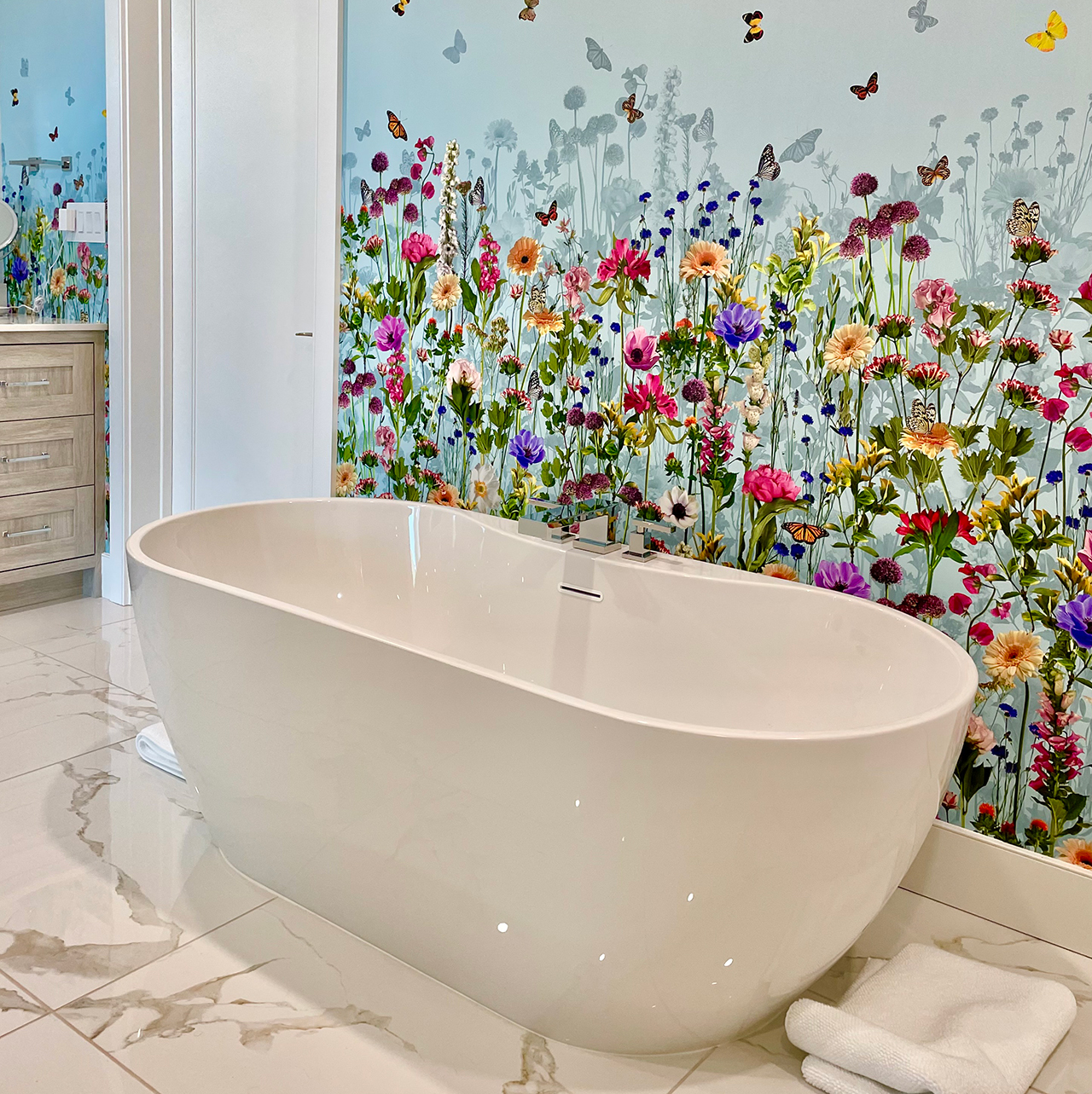 image of soaking tub with floral wallpaper